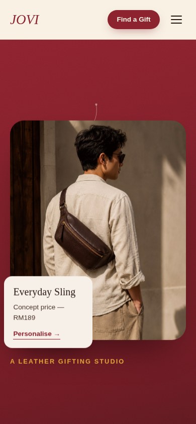 JOVI homepage on a mobile viewport with the maroon campaign hero, headline 'Give something that stays.' and a photograph of the Everyday Sling