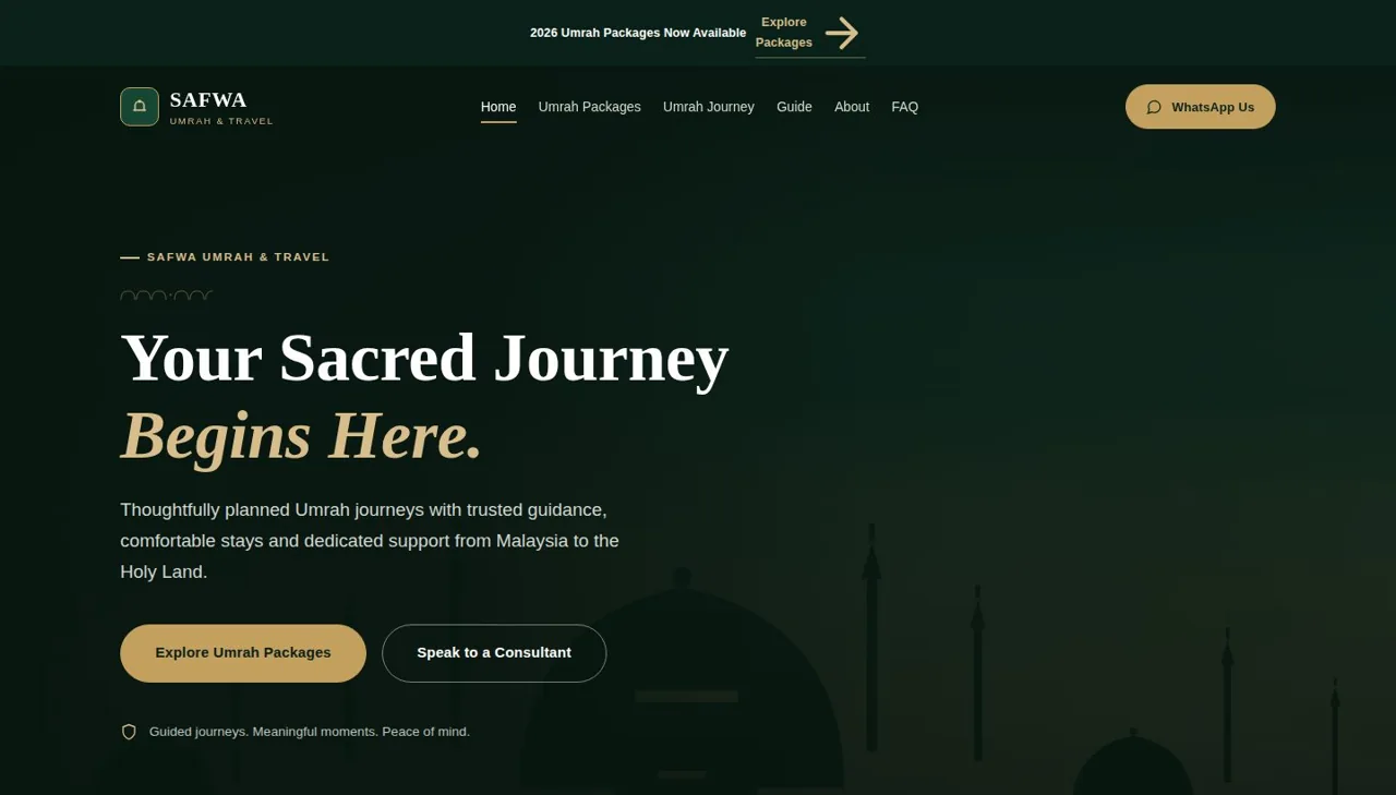 Safwa Umrah travel website homepage with the headline 'Your Sacred Journey Begins Here.' over an illustrated Makkah skyline
